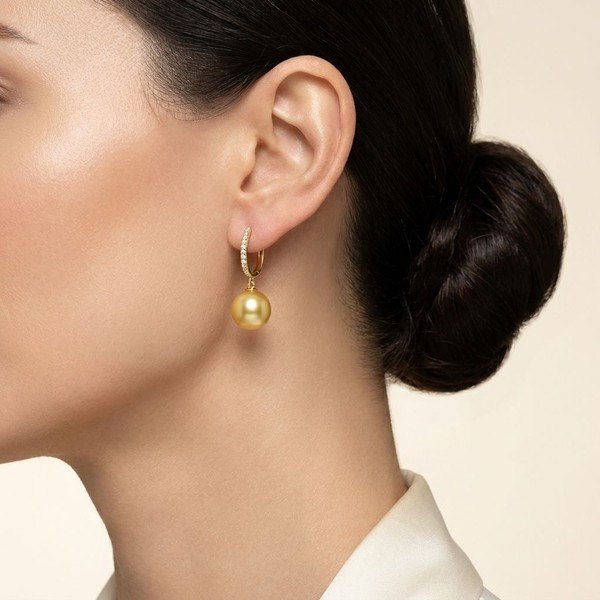 Close-up of Golden Pearl and Diamond Earrings